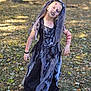 child, halloween, costume, makeup, face_paint, dress, outdoor, autumn, leaves, grass, tree, smile, young, fun, holiday, spooky, person, nature, daylight, playful