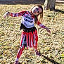 child, costume, halloween, outdoor, grass, tree, shadow, blood, face_paint, pose, dress, red, white, black, shoes, long_hair, smile, sunlight, fall, nature