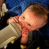 Holden Hudson joined the competition — help win amazing prizes! baby, black_clothing, blanket, blue_blanket, bottle, child, close_up, cozy, eyes, face, feeding, hair, hands, indoor, infant, milk, plush_toy, portrait, sitting, smiling