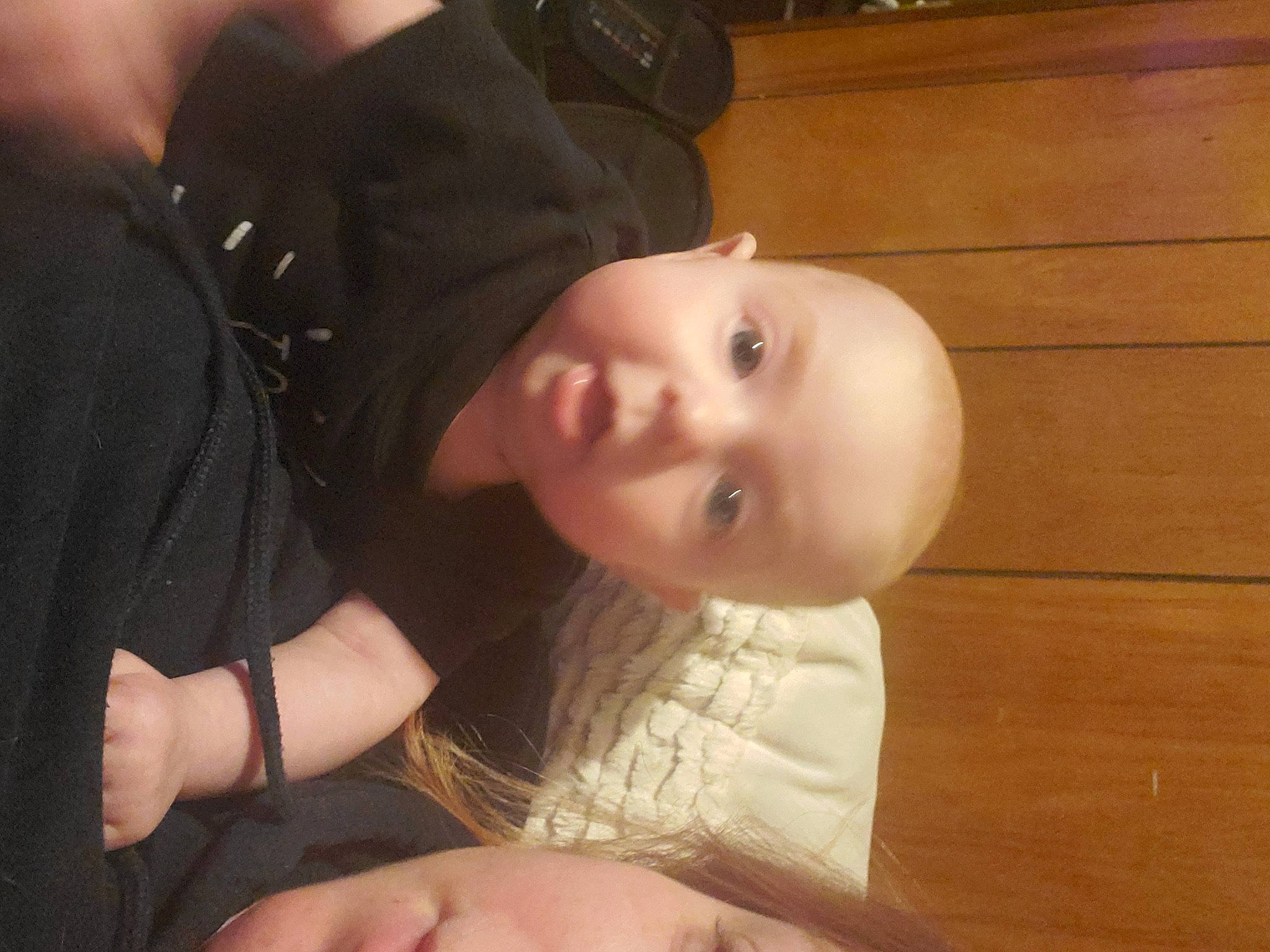 Karissa joined the competition — help win amazing prizes! baby, baby_toddler_clothing, cheek, child, comfort, elbow, eyebrow, finger, flash_photography, flooring, hardwood, hat, nose, person, plank, sitting, sleeve, toddler, varnish, wood