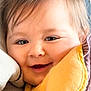 Amelie is registered to the contest to win money with this photo: baby, face, smile, blanket, cozy, child, close_up, happy, soft, warm, portrait, head, skin, hair, expression, infant, comfort, indoors, young, candid