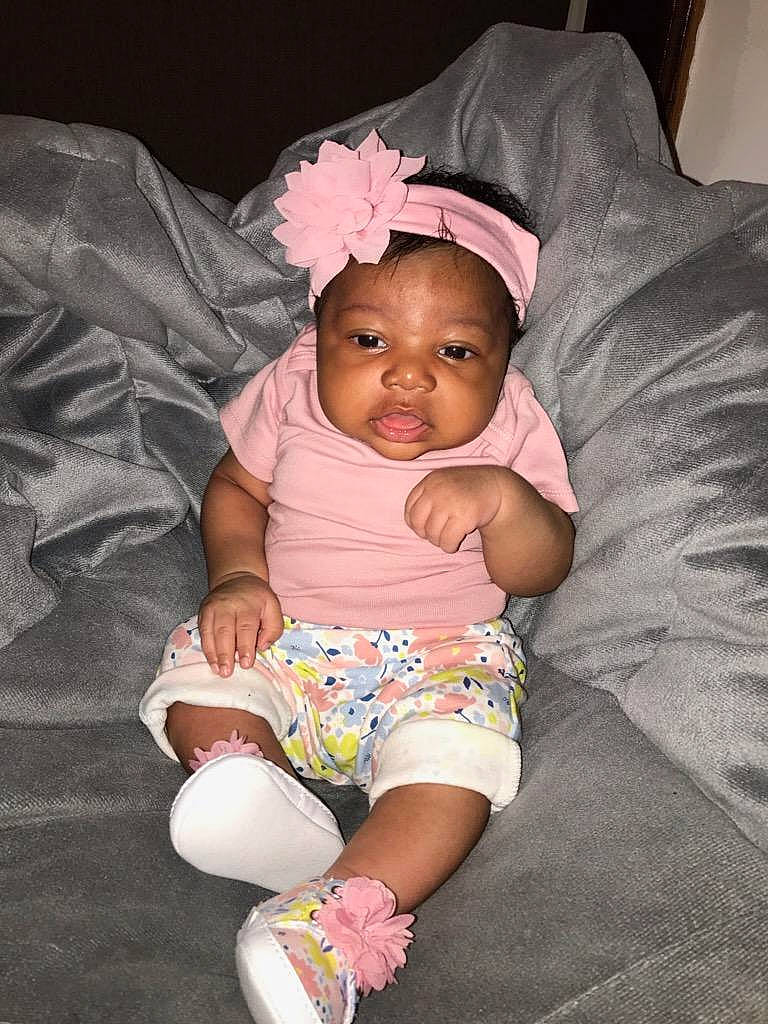 Zari joined the competition — help win amazing prizes! baby, baby_toddler_clothing, child, hair_accessory, headband, headgear, headpiece, iris, person, pink, sitting, skin, toddler