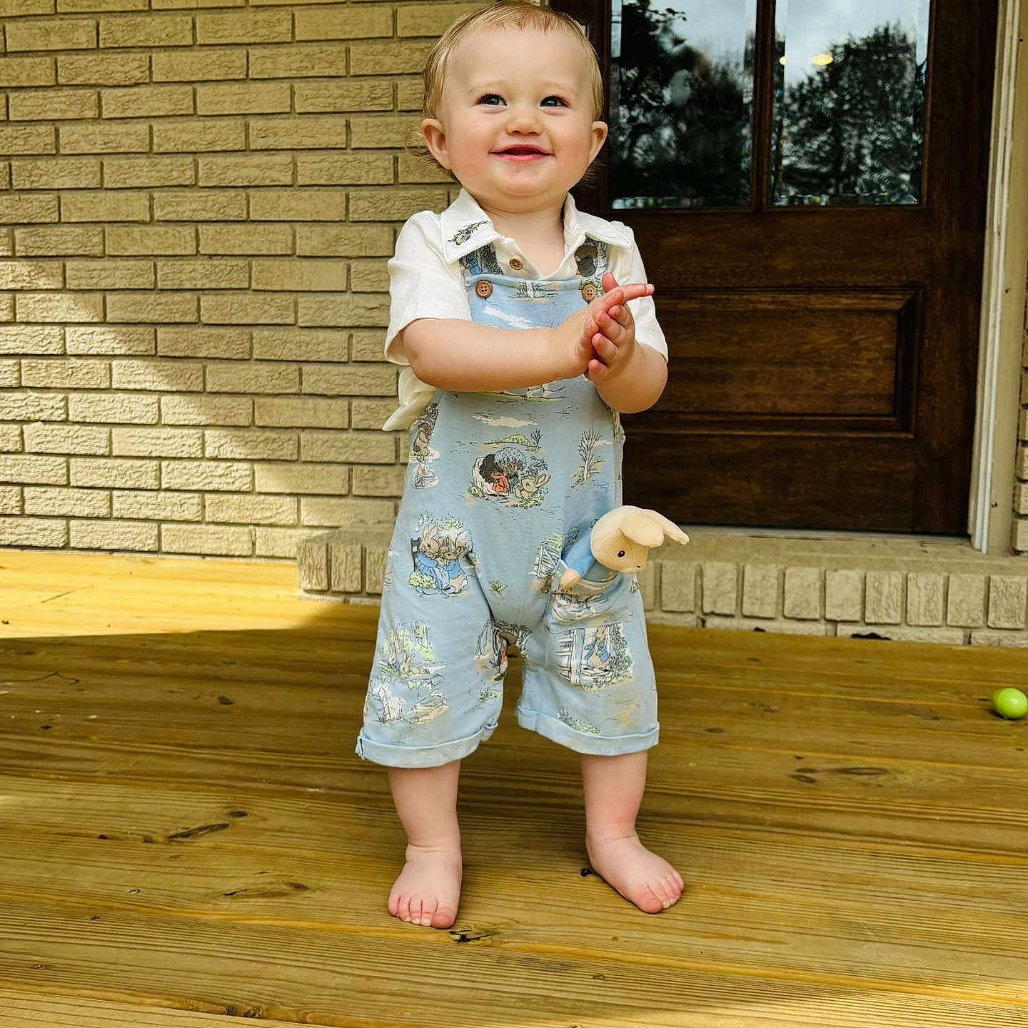 Asher Lane is registered to the contest to win money with this photo: baby, clothing, cream, cutlery, dessert, door, face, food, hardwood, head, icecream, jeans, pants, person, photography, plant, portrait, pottedplant, shorts, wood