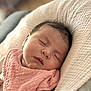 baby, sleeping, infant, pink_bib, soft_texture, close_up, face, peaceful, newborn, cozy, blanket, portrait, child, cute, resting, skin, head, indoors, calm, toddler