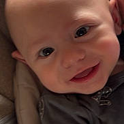 Myles joined the competition — help win amazing prizes! baby, smiling, face, child, infant, closeup, head, eyes, cushion, seat, clothing, happy, skin, indoors, portrait, cute, babywear, cheerful, small, person