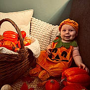 Aaron participe au concours pour gagner de l'argent avec cette photo : autumn, baby, basket, child, costume, cozy, cute, decor, face, fall_leaves, festive, happy, holiday, indoor, orange, plush, pumpkin_costume, seasonal, sitting, smile