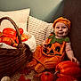 autumn, baby, basket, child, costume, cozy, cute, decor, face, fall_leaves, festive, happy, holiday, indoor, orange, plush, pumpkin_costume, seasonal, sitting, smile