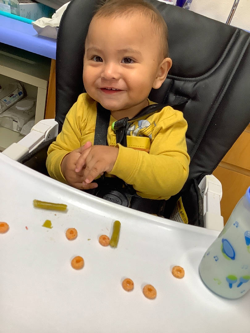 Jericho is registered to the contest to win money with this photo: baby, baby_playing_with_toys, baby_products, baby_safety, baby_toddler_clothing, chair, cheek, child, comfort, fun, joy, person, plastic, play, product, room, sharing, sitting, smile, t_shirt