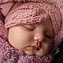 adorable, baby, child, closeup, cozy, cute, face, fluffy_clothing, headwear, infant, knit_hat, peaceful, pink, portrait, resting, sleeping, soft_texture, warm, winter_wear, young_child
