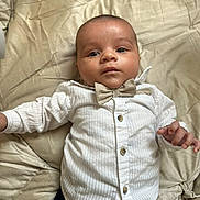 Kayden participe au concours pour gagner de l'argent avec cette photo : baby, infant, child, face, person, clothing, bow_tie, white_shirt, blanket, fabric, portrait, cute, indoors, lying_down, skin, hand, button, eyes, head, expression