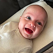 Oscar joined the competition — help win amazing prizes! baby, smiling, infant, face, onesie, happy, closeup, child, cute, lying_down, soft_texture, crib, stroller, skin, eyelashes, mouth_open, expression, warm_lighting, head, indoors