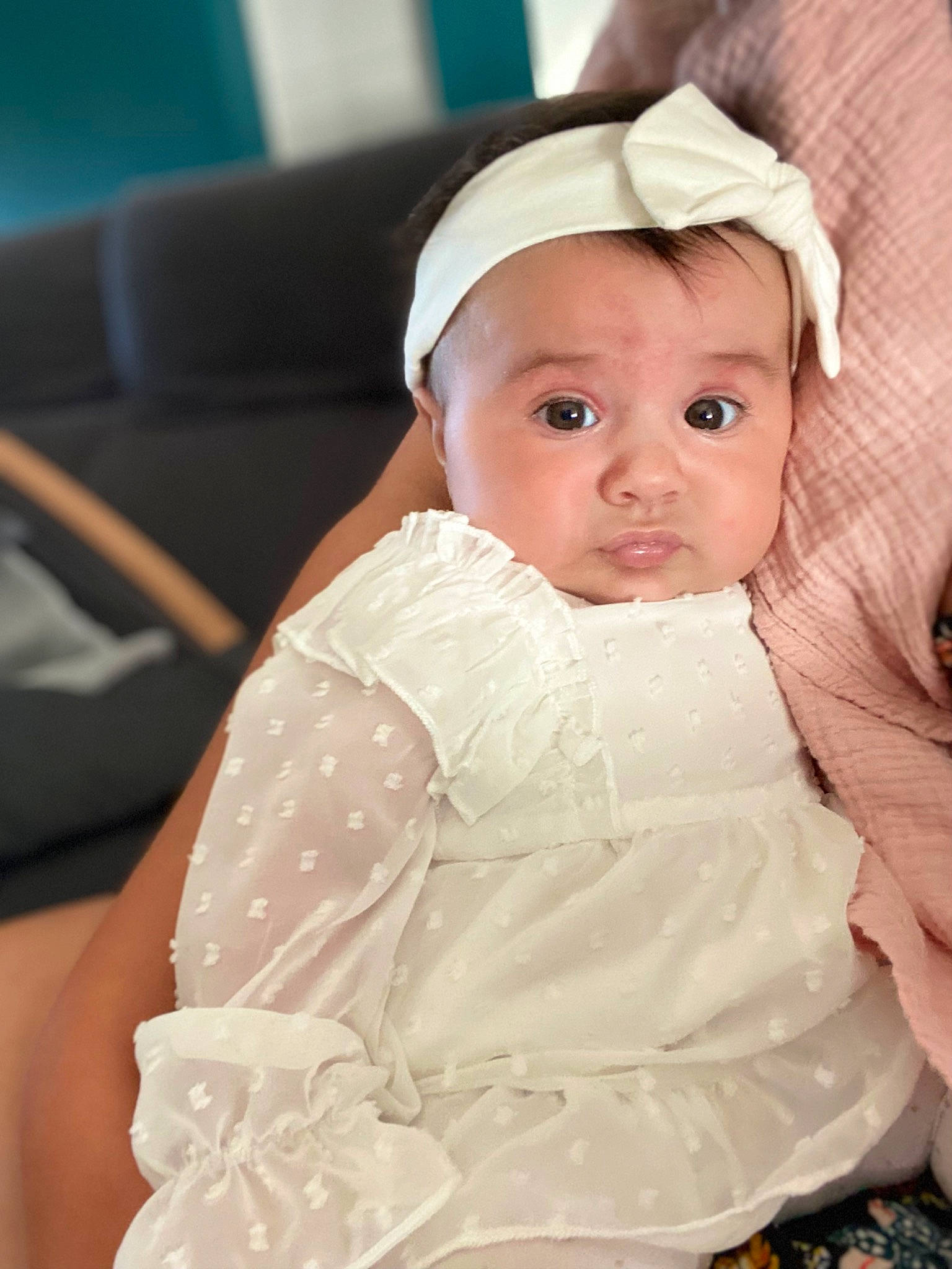 Serena participe au concours pour gagner de l'argent avec cette photo : baby, baby_products, baby_toddler_clothing, bridal_accessory, cheek, child, comfort, dress, embellishment, event, eye, fashion_accessory, happy, headgear, iris, lip, person, sitting, skin, sleeve