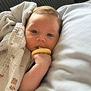Luka joined the competition — help win amazing prizes! baby, blanket, pacifier, pillow, couch, face, hand, infant, child, comfort, rest, indoor, soft, sleepy, portrait, closeup, skin, head, eyes, cozy