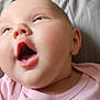 Natalie joined the competition — help win amazing prizes! baby, infant, close_up, pink_clothing, mouth_open, joyful_expression, face, skin, head, person, soft_surface, indoors, child, cute, newborn, portrait, human, sleepwear, young, happy