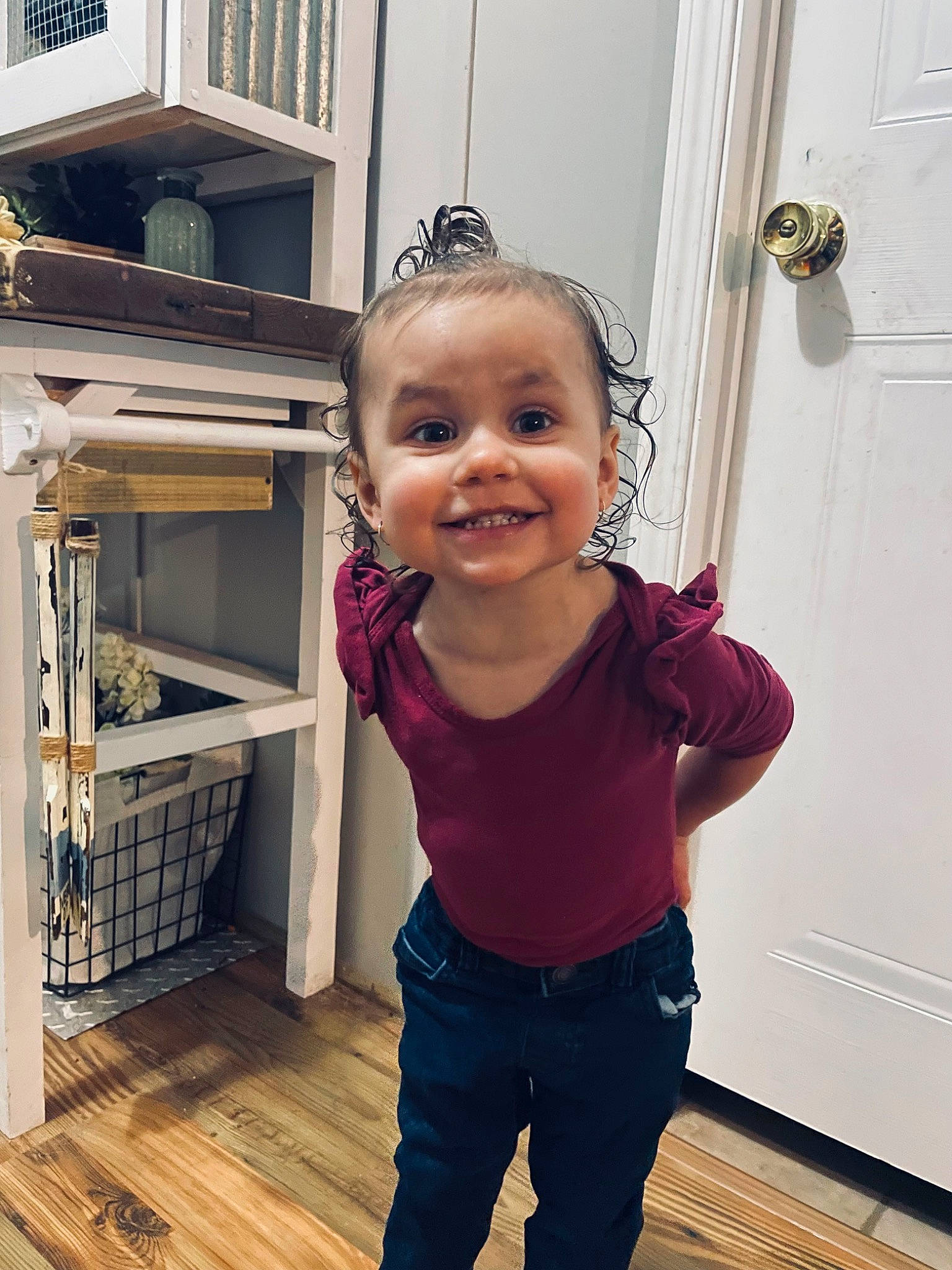 Oakley is registered to the contest to win money with this photo: baby, baby_toddler_clothing, building, child, door, eye, floor, flooring, happy, hardwood, joint, joy, magenta, person, sleeve, smile, standing, t_shirt, thumb, toddler