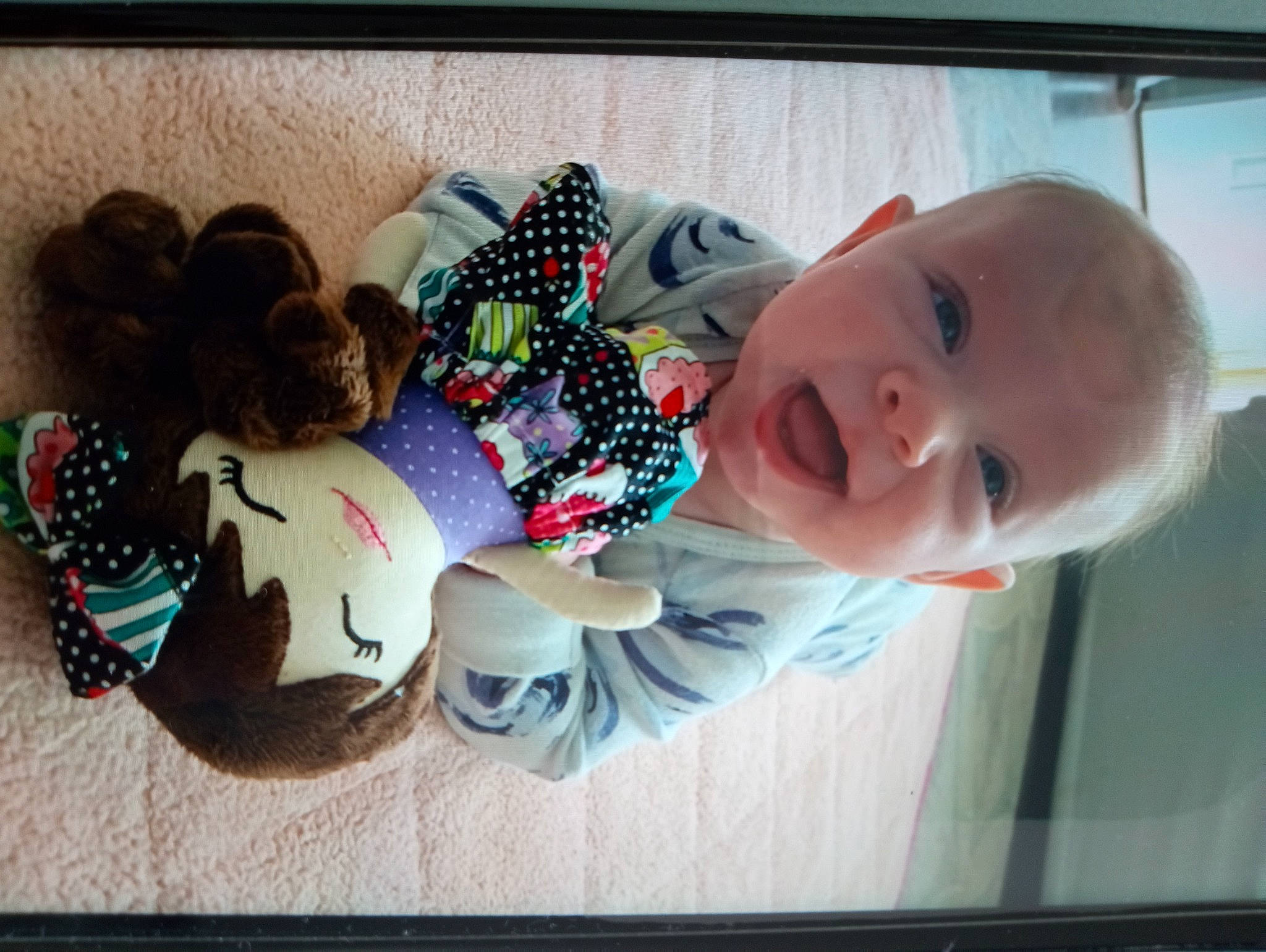 Nevaeh is registered to the contest to win money with this photo: baby, baby_laughing, baby_products, baby_toddler_clothing, carmine, cheek, child, flooring, fun, hair, happy, people, person, plush, product, room, smile, stuffed_toy, toddler, toy