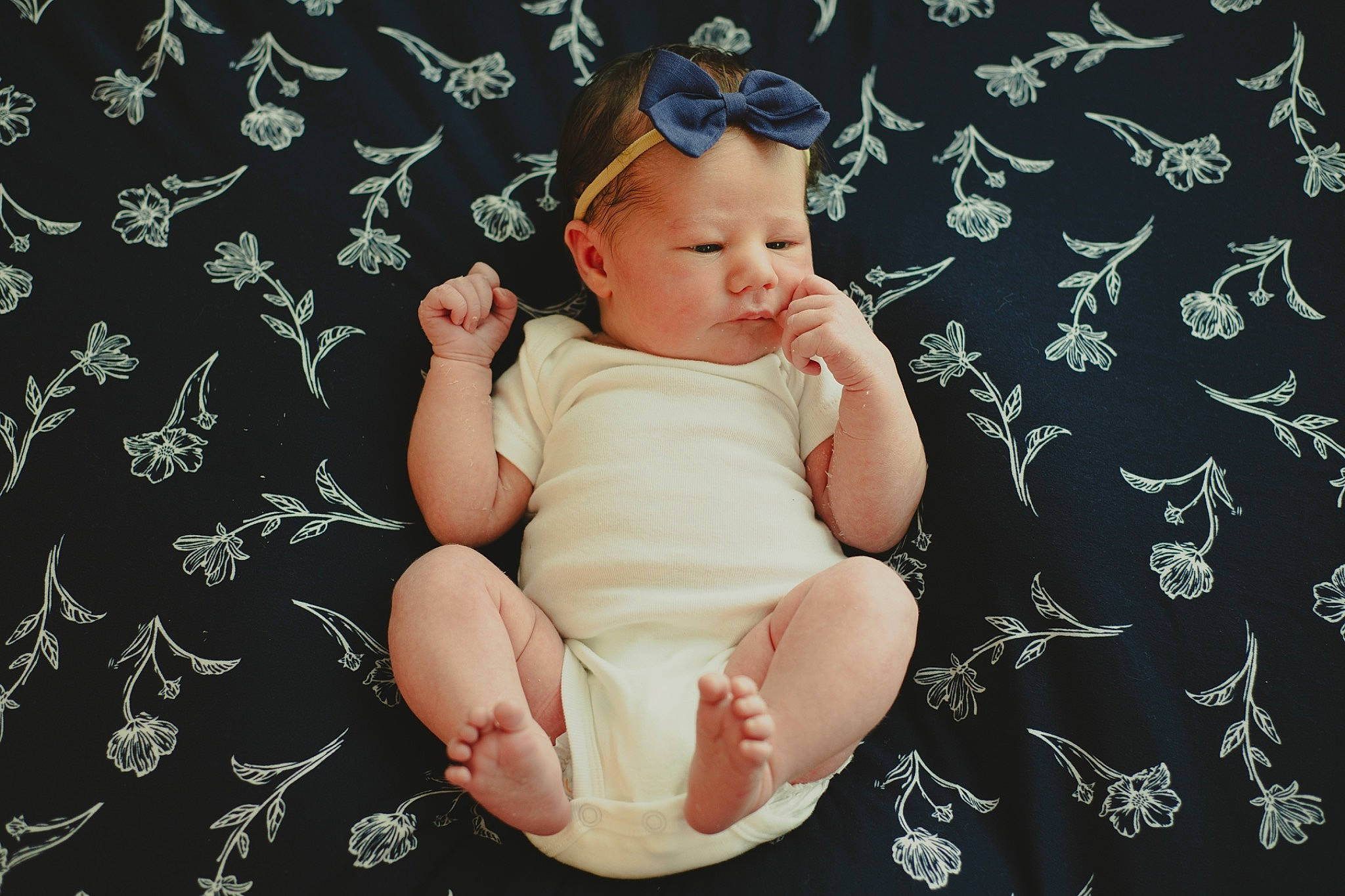 Hadley joined the competition — help win amazing prizes! arm, baby, baby_toddler_clothing, barefoot, child, finger, flash_photography, foot, gesture, goggles, hand, happy, head, human_leg, knee, pattern, person, sitting, thigh, thumb