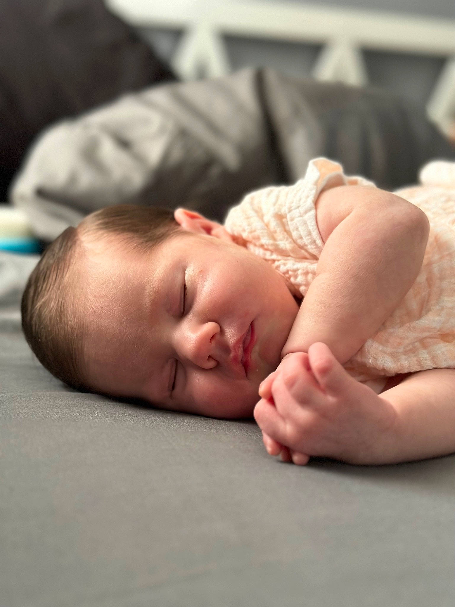 Hadley is registered to the contest to win money with this photo: baby, baby_toddler_clothing, cheek, child, comfort, event, eye, eyelash, finger, flesh, flooring, linens, person, portrait_photography, room, skin, toddler, wood