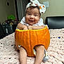 Sarahis joined the competition — help win amazing prizes! baby, infant, pumpkin, headband, smile, happy, blanket, indoors, legs, feet, bracelet, cute, child, fall, autumn, holiday, costume, orange, soft, portrait