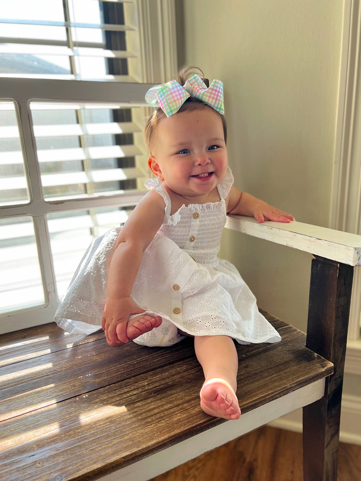 Briggs is registered to the contest to win money with this photo: baby, baby_toddler_clothing, child, chin, clothing, dress, facial_expression, finger, flash_photography, hand, happy, joy, leg, person, pink, skin, smile, stairs, standing, toddler