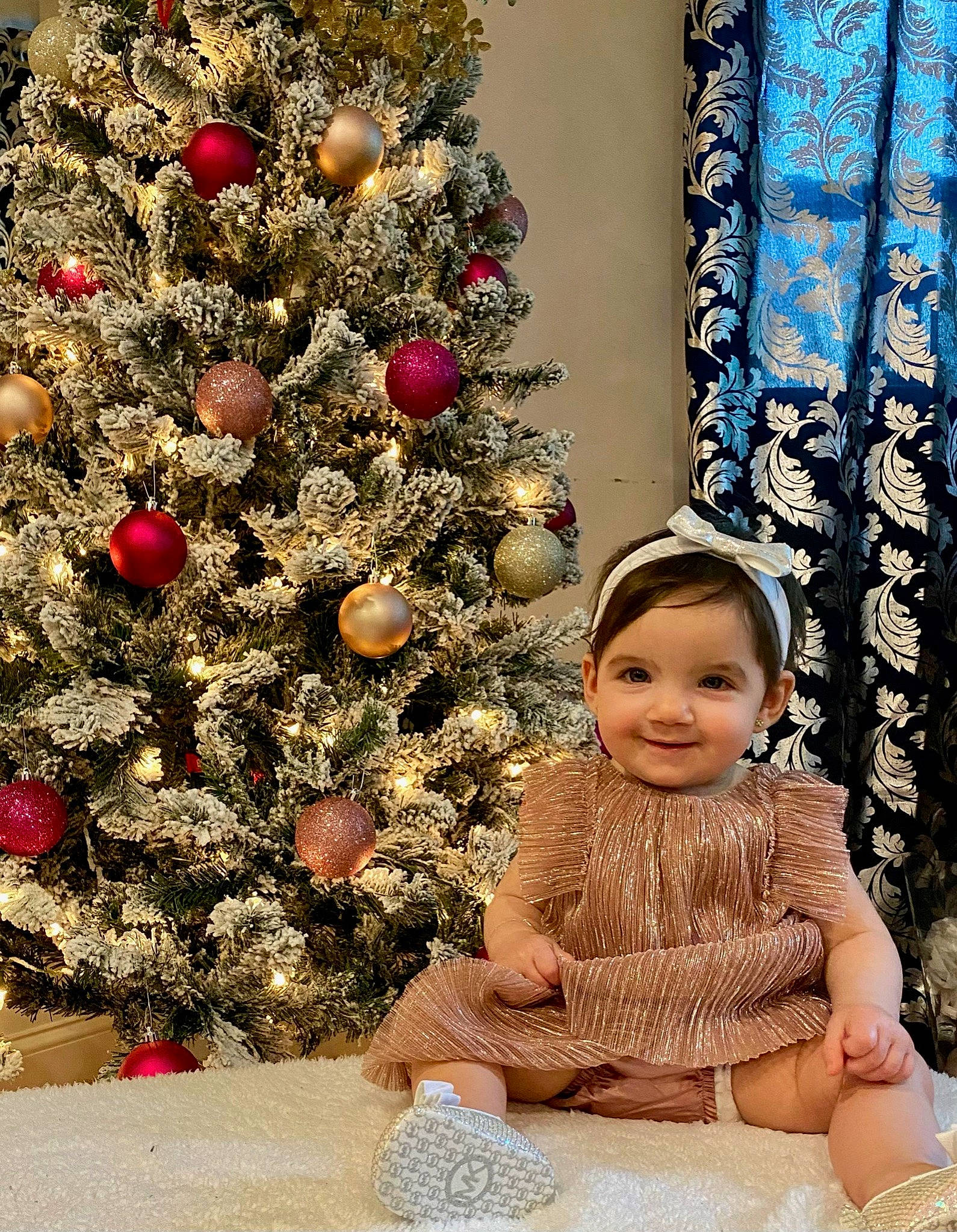 Rylie joined the competition — help win amazing prizes! baby, baby_toddler_clothing, christmas, christmas_decoration, christmas_eve, christmas_lights, christmas_ornament, christmas_tree, conifer, curtain, evergreen, fir, holiday, holiday_ornament, human, interior_design, joy, ornament, person, pine_family