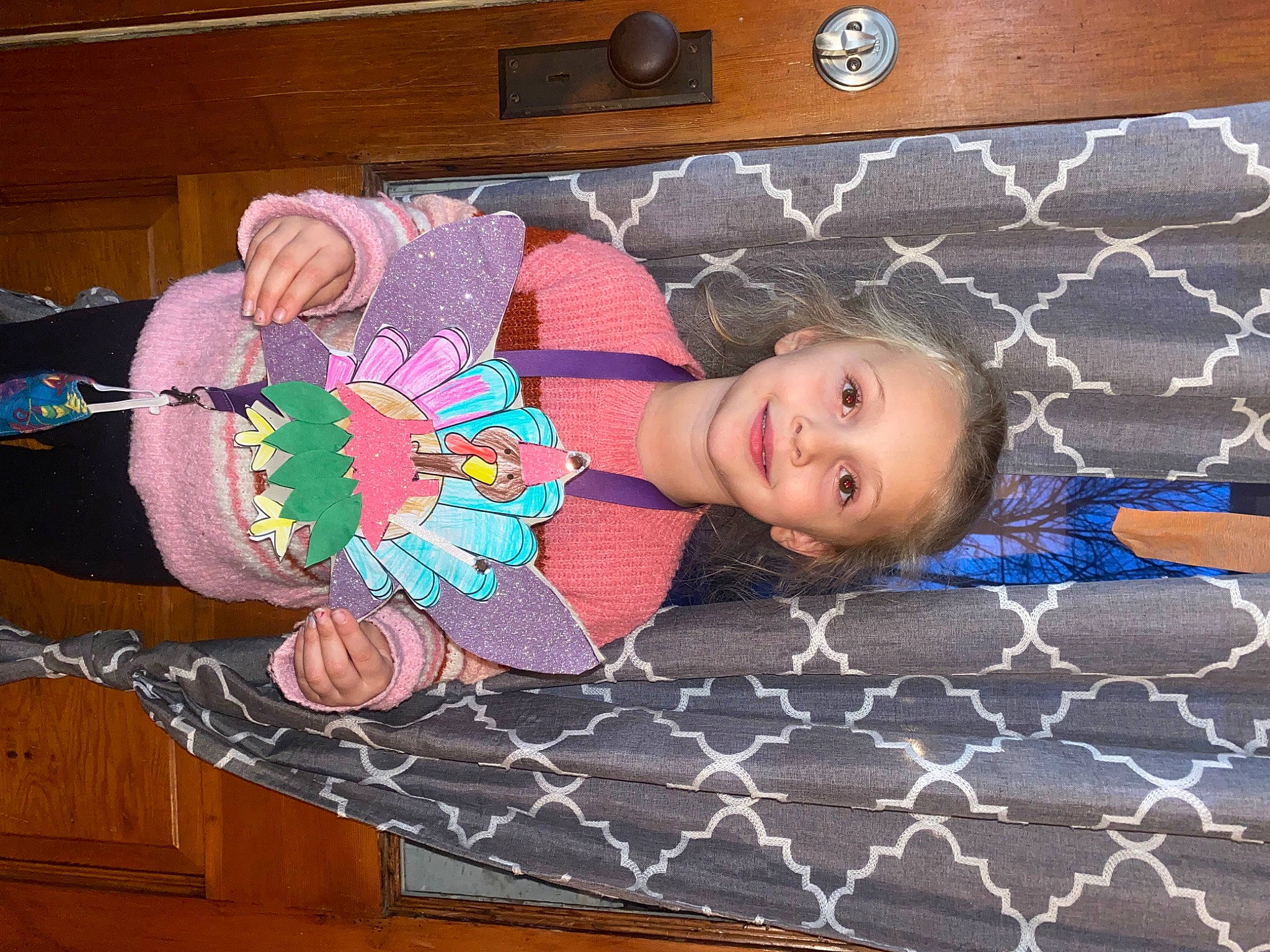 Jade is registered to the contest to win money with this photo: baby_toddler_clothing, child, comfort, design, electric_blue, face, flooring, fun, happy, hardwood, joy, linens, mesh, pattern, person, purple, room, smile, textile, toddler