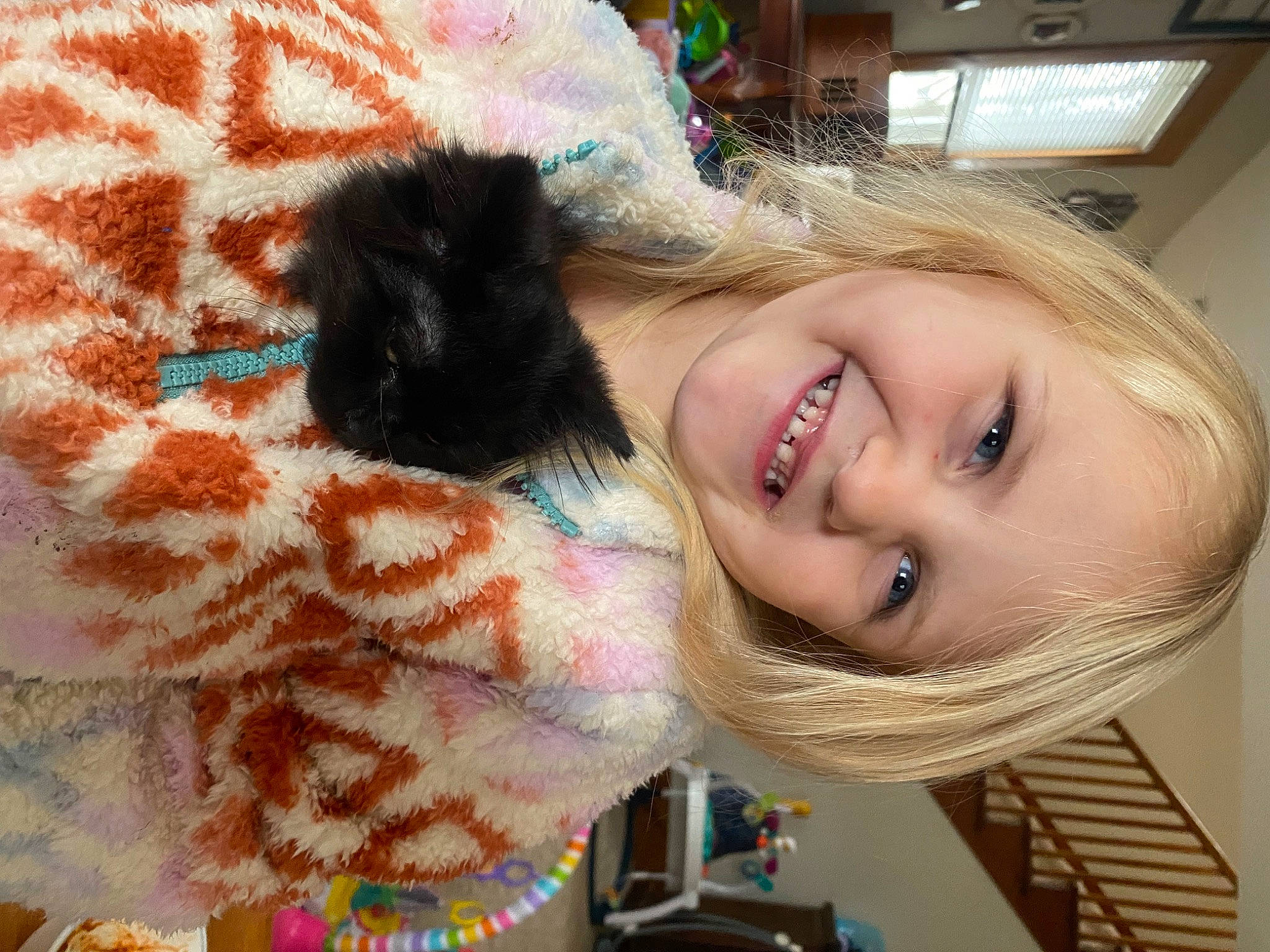 Ella joined the competition — help win amazing prizes! beauty, blond, brown_hair, eye, fawn, fun, fur, happy, iris, joy, linens, lip, long_hair, mammal, pattern, person, pink, skin, smile, toy