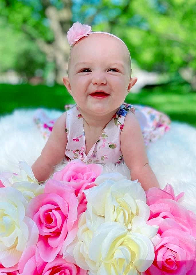 Lillian Rose joined the competition — help win amazing prizes! baby, baby_toddler_clothing, dress, event, flower, flower_arranging, formal_wear, fun, grass, happy, headpiece, magenta, person, petal, pink, plant, rose, smile, toddler, wedding_ceremony_supply