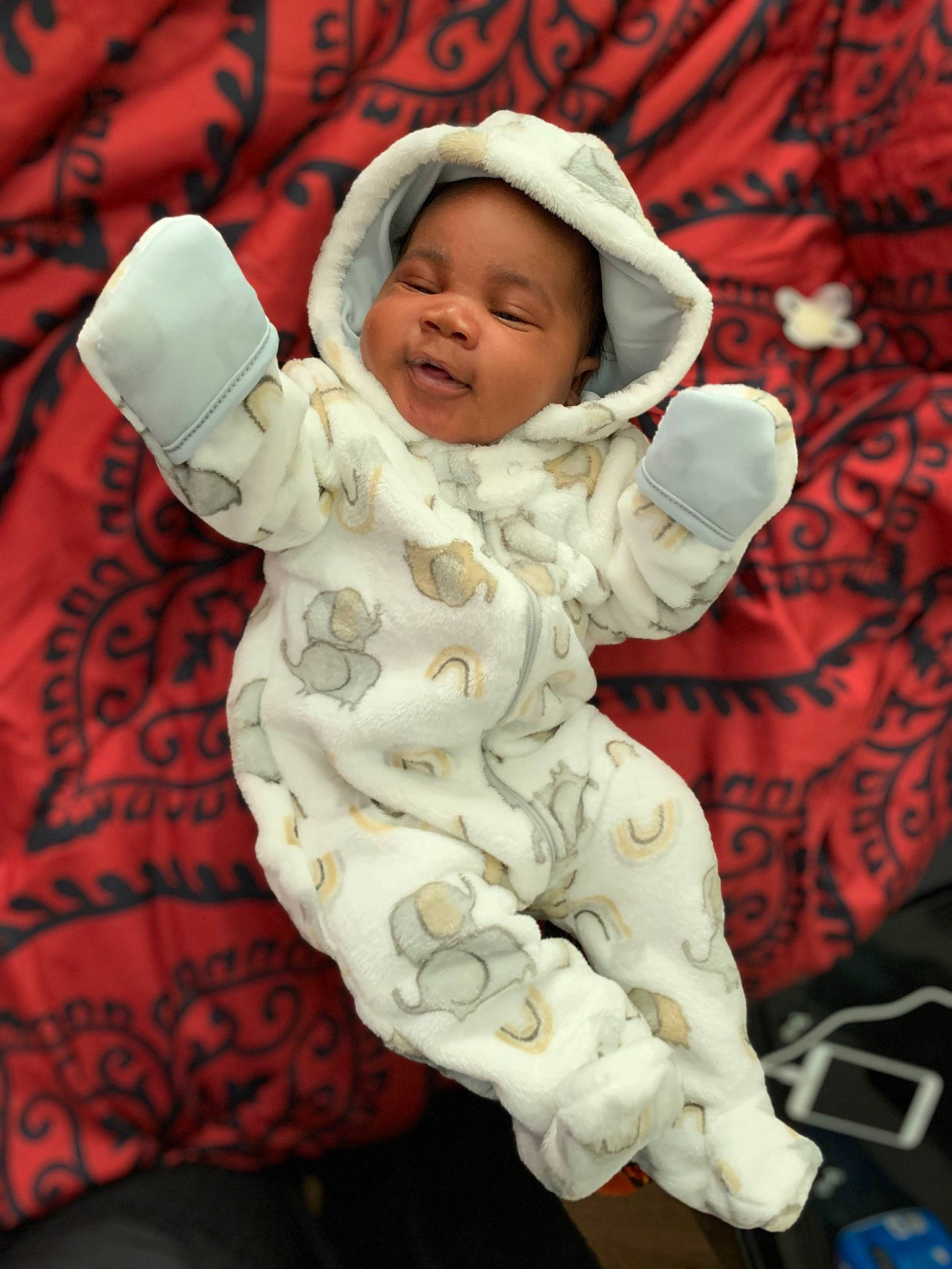 Khalil joined the competition — help win amazing prizes! baby, baby_sleeping, baby_toddler_clothing, cap, child, comfort, face, fur, happy, hat, headwear, linens, pattern, person, plant, sitting, sleeve, toddler