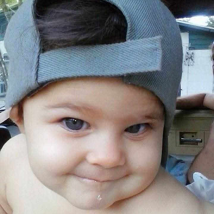 Abbiegail is registered to the contest to win money with this photo: baby, background, cap, casual, cheeks, child, closeup, cute, drool, expression, eyes, face, hat, headwear, outdoor, person, portrait, skin, smile, young