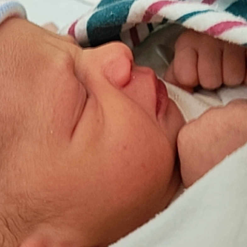 Ja'Kya joined the competition — help win amazing prizes! architecture, baby, blanket, bodypart, bonnet, building, cap, clothing, face, finger, hand, hat, head, hospital, newborn, person, photography, portrait, sleeping, towel