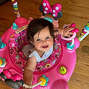 Myla joined the competition — help win amazing prizes! baby, child, smiling, pink, walker, toy, floor, indoor, person, happy, mickey_mouse, minnie_mouse, colorful, infant, clothing, face, hand, hair, playful, seat