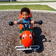 Zion joined the competition — help win amazing prizes! car, child, clothing, face, fun, grass, happy, orange, outdoor, play, playground, sidewalk, smiling, spring_rider, suburban, summer, sunny, toddler, toy, wood_chips