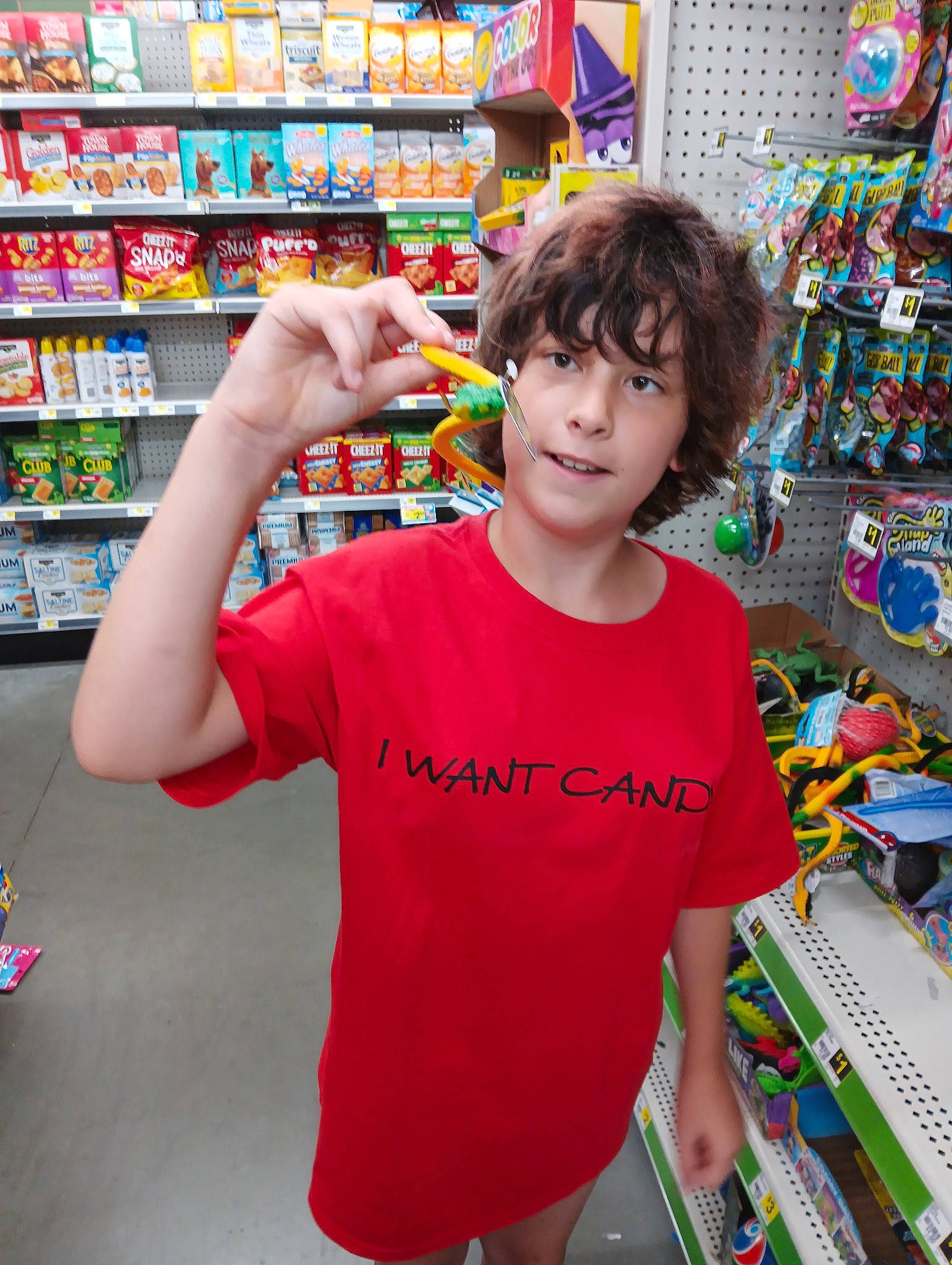 Emily joined the competition — help win amazing prizes! child, convenience_store, customer, event, fun, grocery_store, happy, leisure, marketplace, person, play, recreation, retail, selling, shelf, shopping, sleeve, smile, standing, t_shirt