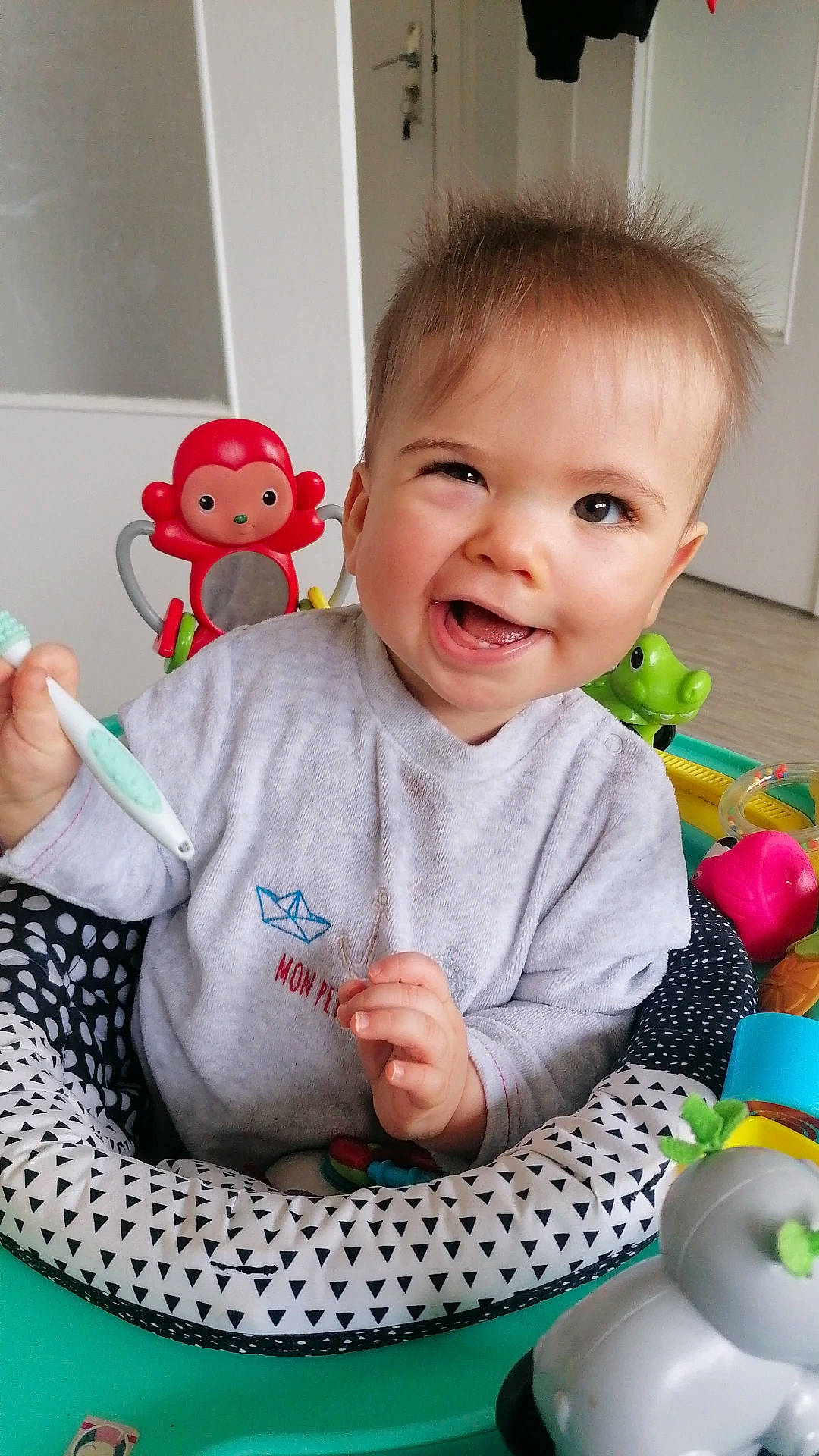 Curtis participe au concours pour gagner de l'argent avec cette photo : arm, baby, baby_playing_with_toys, baby_toddler_clothing, cheek, child, facial_expression, fun, hand, happy, joy, pattern, person, product, sitting, skin, sleeve, smile, t_shirt, toddler