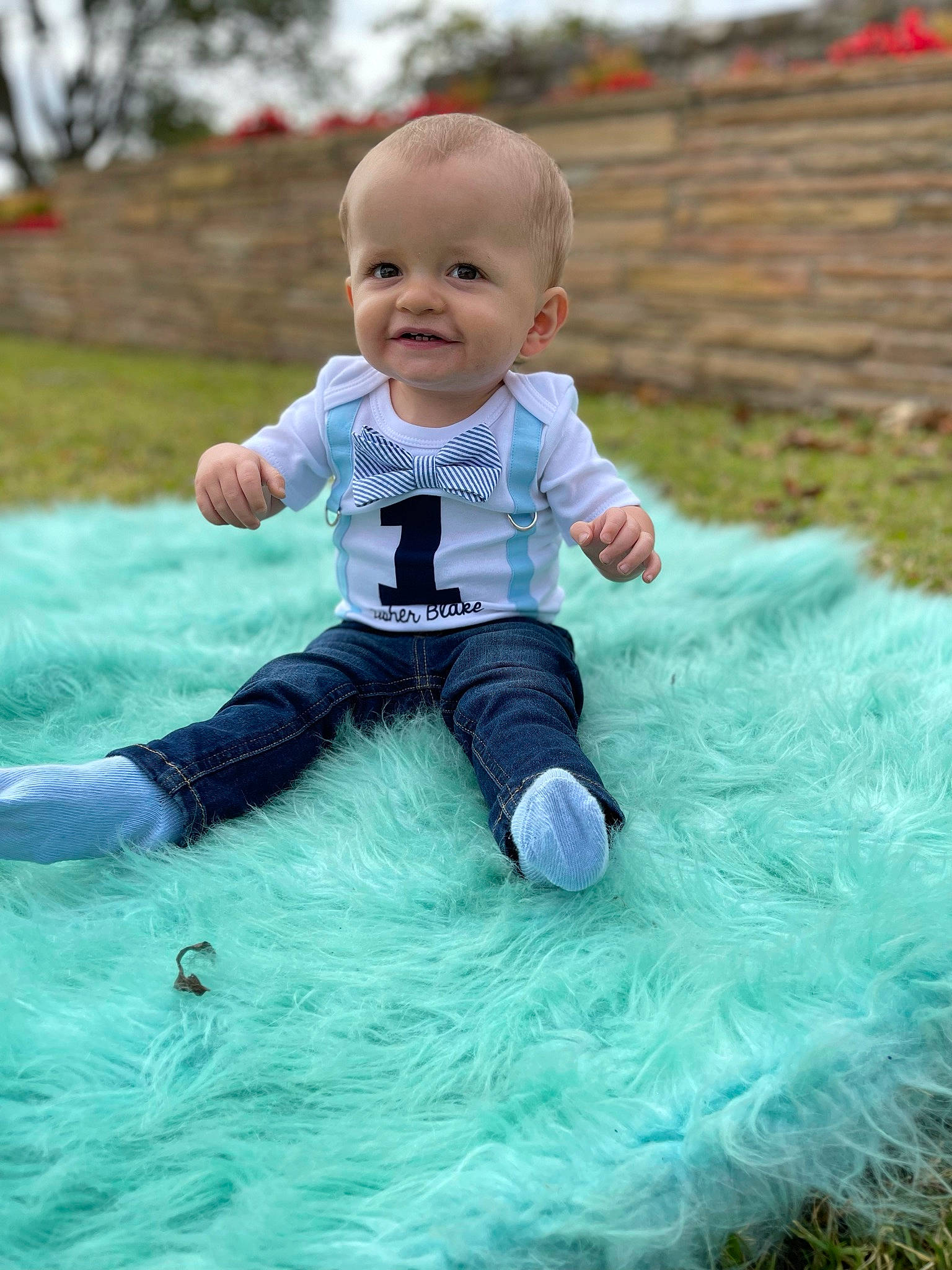Asher is registered to the contest to win money with this photo: aqua, baby, baby_products, baby_toddler_clothing, child, eye, face, fun, grass, happy, leisure, people_in_nature, person, plant, play, recreation, sitting, sleeve, smile, t_shirt