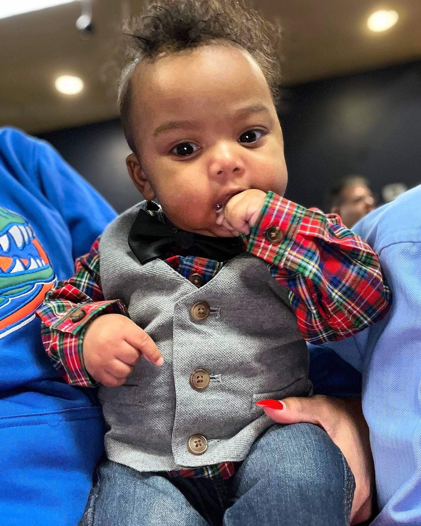 Damir is registered to the contest to win money with this photo: baby, baby_toddler_clothing, blurred, cheek, child, collar, comfort, finger, fun, hand, happy, iris, lip, nose, pattern, person, plaid, sitting, skin, sleeve