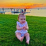 baby, boat, child, clapping, clouds, grass, happy, nature, outdoor, people, pier, relaxation, scenic, sitting, sky, smiling, summer, sunset, vacation, water