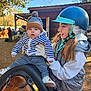 Nino participe au concours pour gagner de l'argent avec cette photo : accessories, animal, baby, bag, cap, clothing, equestrian, face, footwear, glove, handbag, hardhat, hat, head, helmet, horse, person, photography, portrait, shoe