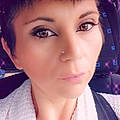 Evelyne E.