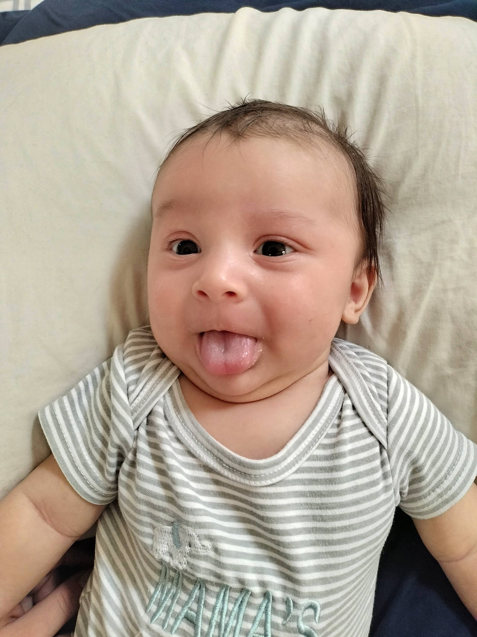 X'Adrian is registered to the contest to win money with this photo: baby, baby_toddler_clothing, cheek, clothing, comfort, eyebrow, eyelash, hair, happy, iris, lip, mouth, nose, person, sitting, skin, sleeve, smile, surprise, t_shirt