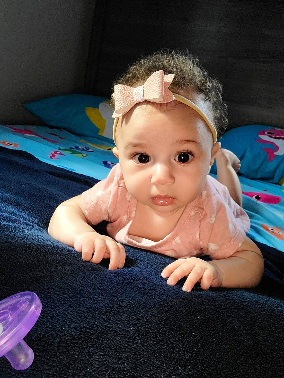 Everla is registered to the contest to win money with this photo: baby, baby_toddler_clothing, cheek, child, eye, eyelash, finger, fun, gesture, happy, head, headpiece, iris, nail, person, pink, skin, textile, thumb, toddler