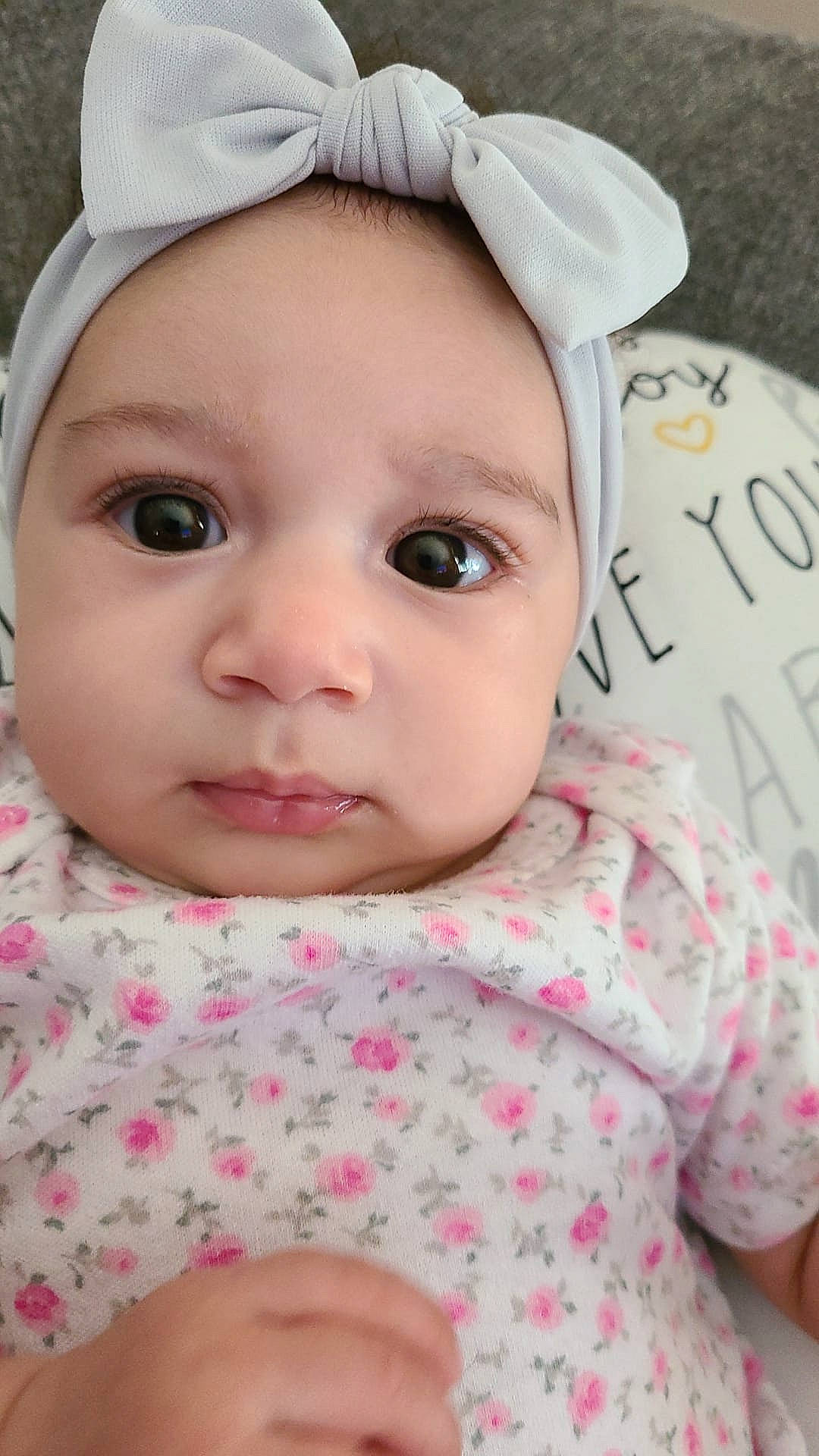 Everla is registered to the contest to win money with this photo: baby, baby_toddler_clothing, cap, cheek, chin, dress, eye, eyebrow, eyelash, face, facial_expression, forehead, headwear, lip, nose, person, pink, product, skin, sleeve