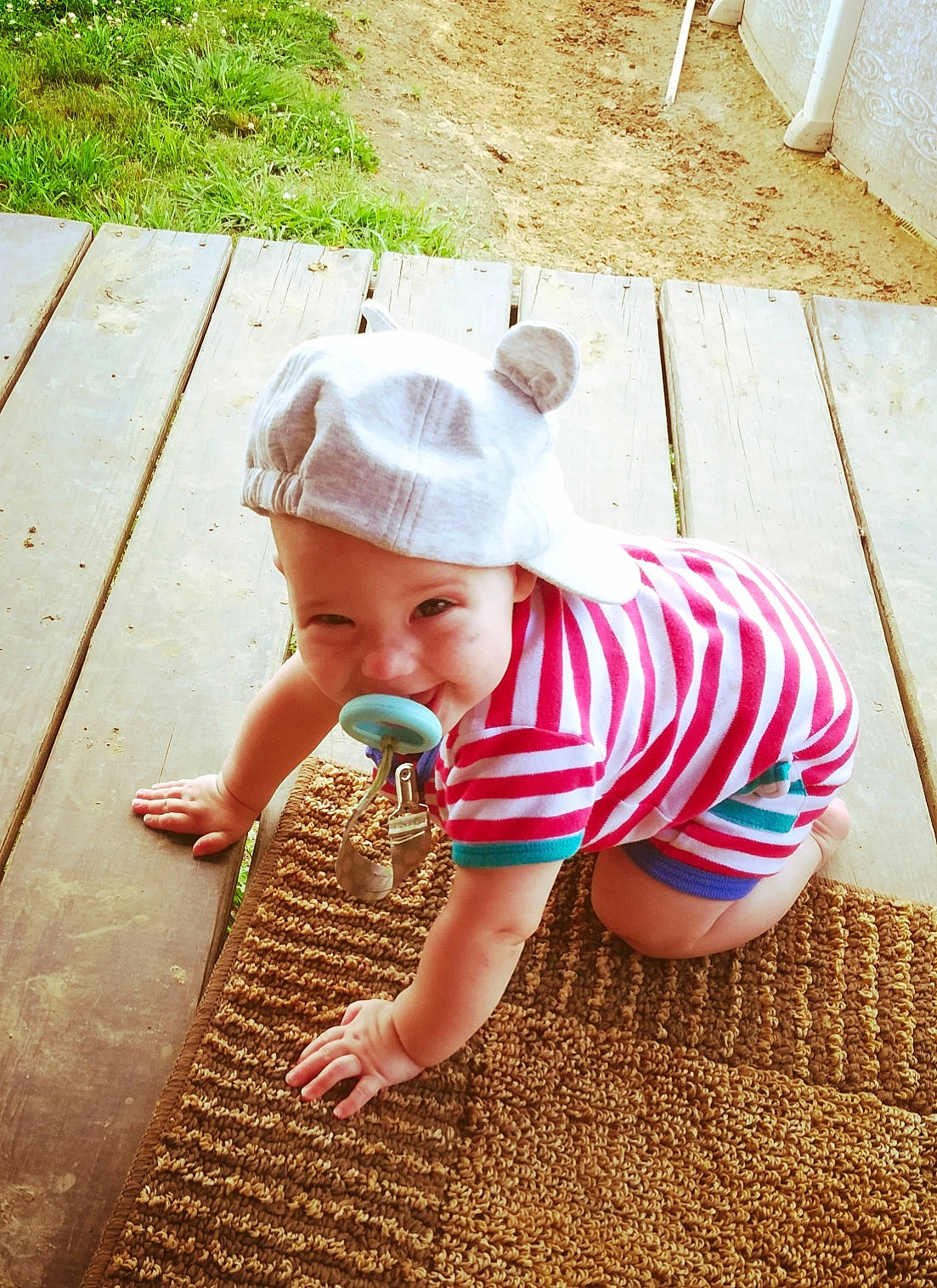 Azrael is registered to the contest to win money with this photo: baby, child, crawling, floor, flooring, fun, grass, hat, headgear, headwear, person, play, skin, summer, sun_hat, toddler, vacation