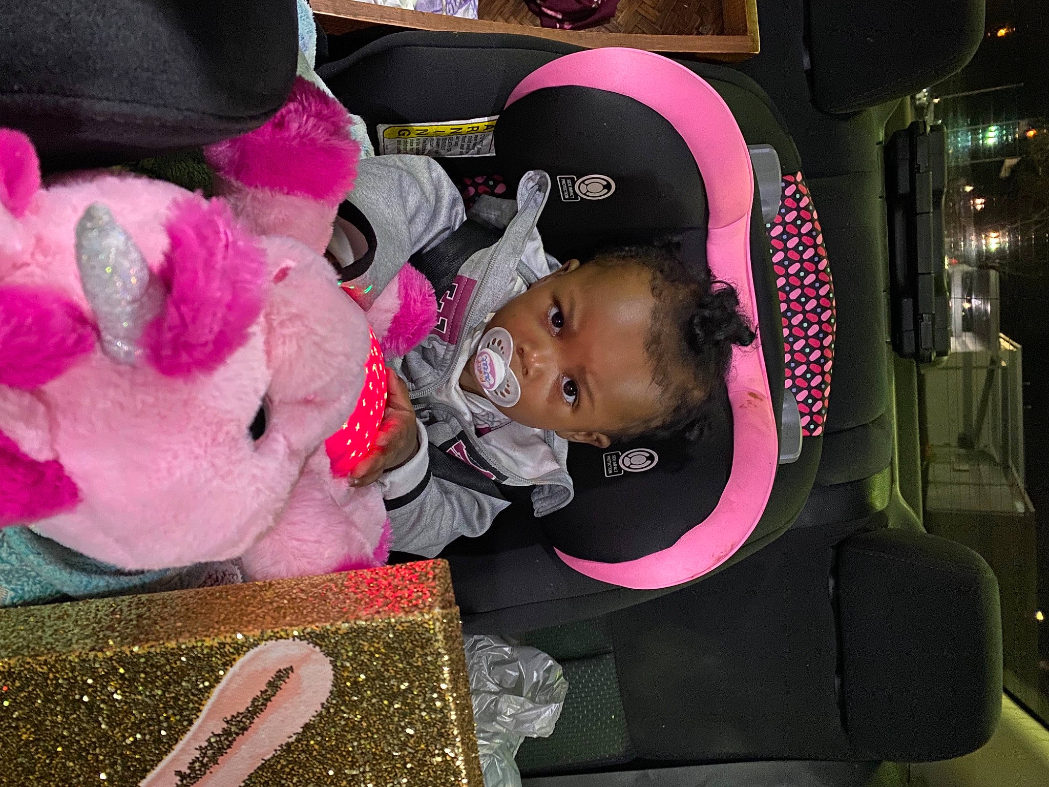 Rihanna is registered to the contest to win money with this photo: baby, baby_products, child, costume, event, fashion_accessory, fun, fur, hat, magenta, nail, person, pink, plush, room, stuffed_toy, teddy_bear, textile, toddler, toy