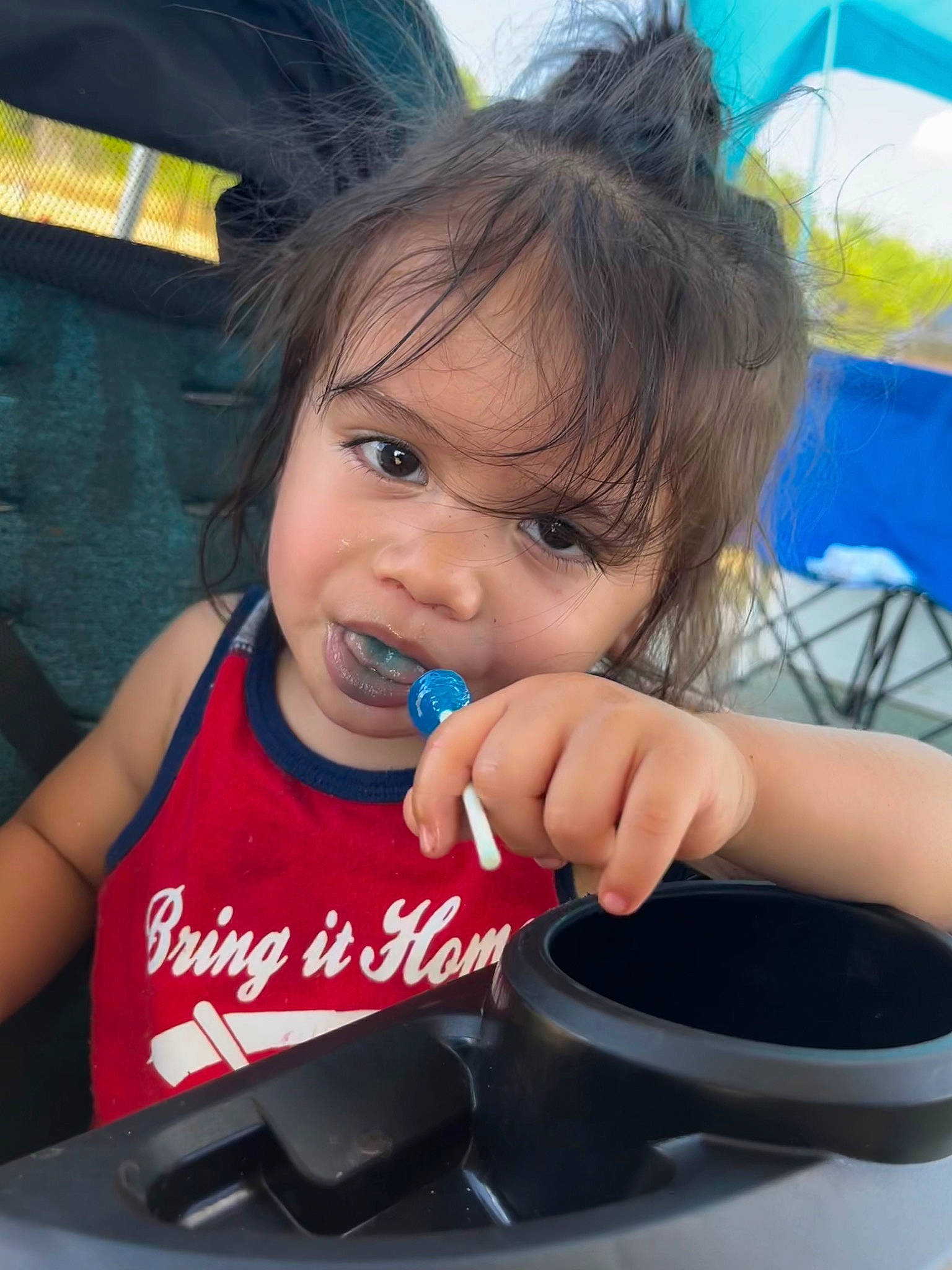 King is registered to the contest to win money with this photo: arm, auto_part, baby, baby_toddler_clothing, blue, cheek, child, chin, electric_blue, finger, fun, happy, mouth, nail, person, recreation, sitting, skin, steering_wheel, thumb