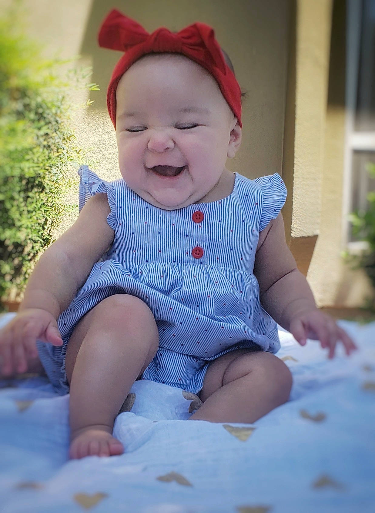 Elicia is registered to the contest to win money with this photo: baby, baby_toddler_clothing, beauty, blue, cheek, child, ear, eye, face, facial_expression, fun, head, headgear, headwear, lip, person, photography, pink, sitting, skin