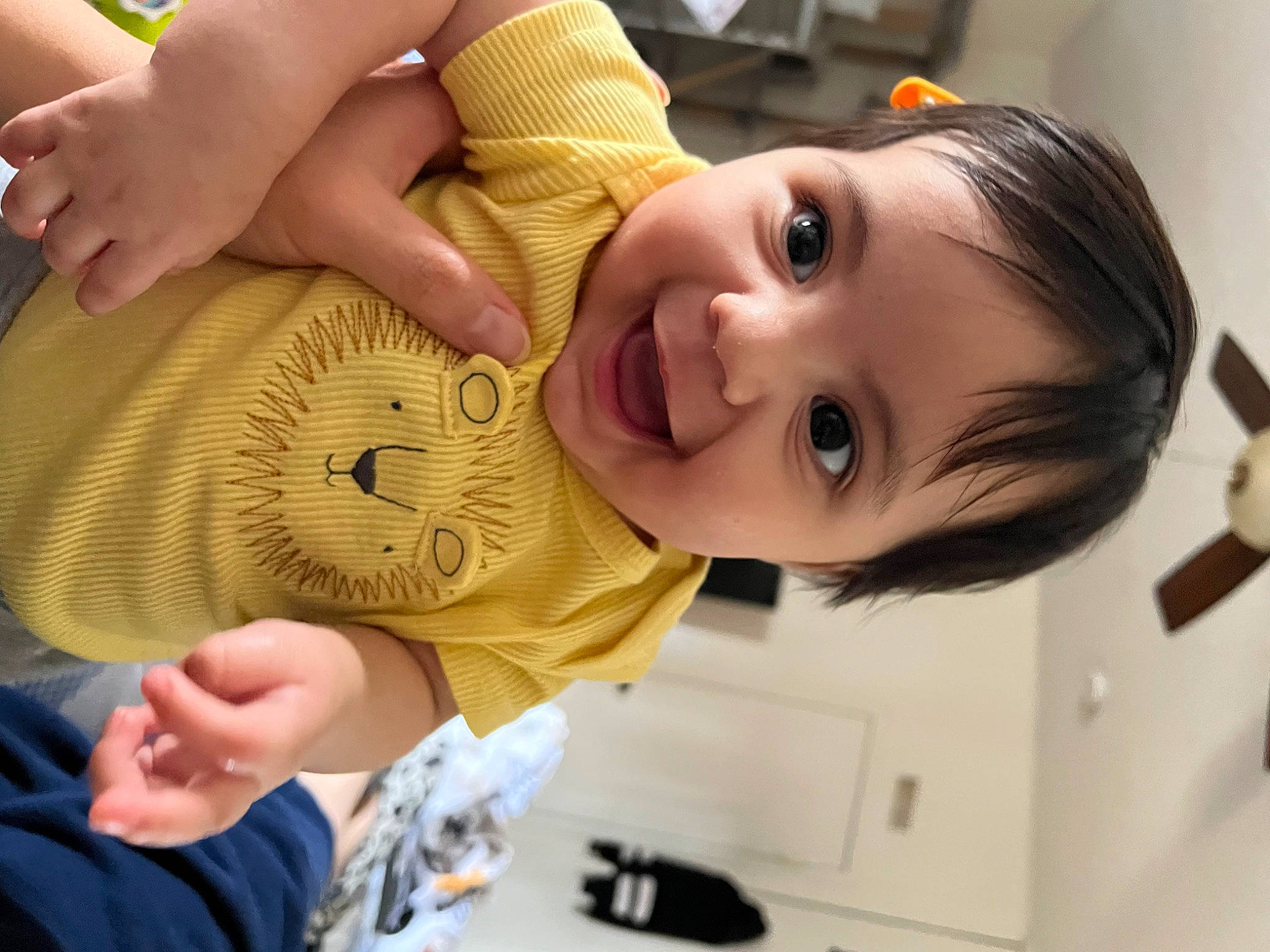 Aurora is registered to the contest to win money with this photo: baby, baby_toddler_clothing, cheek, child, ear, eyelash, finger, gesture, hand, happy, human_body, iris, joy, lip, mouth, nose, person, skin, smile, thumb