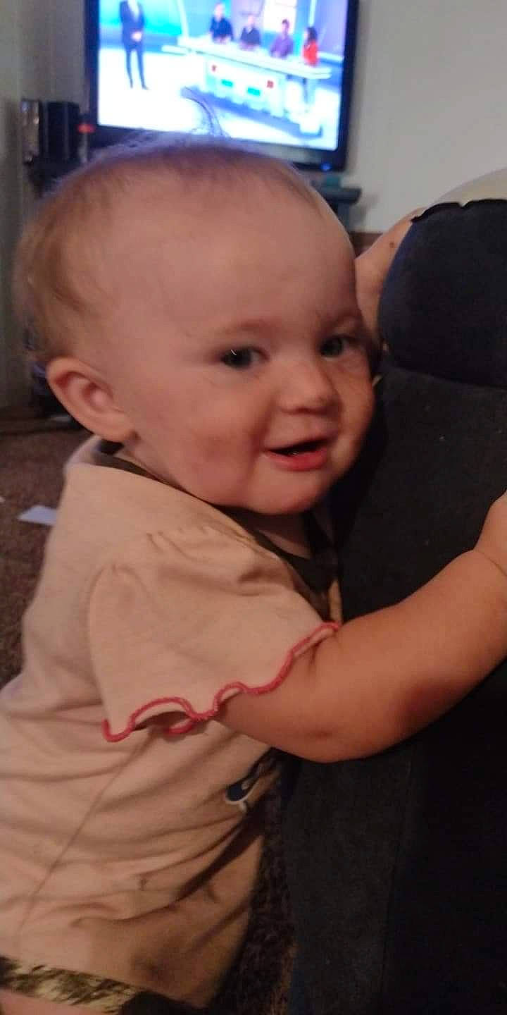 Alexis is registered to the contest to win money with this photo: baby, baby_toddler_clothing, cheek, chin, ear, eyebrow, finger, fun, gesture, happy, human_body, iris, mouth, nose, person, skin, sleeve, smile, television, thumb