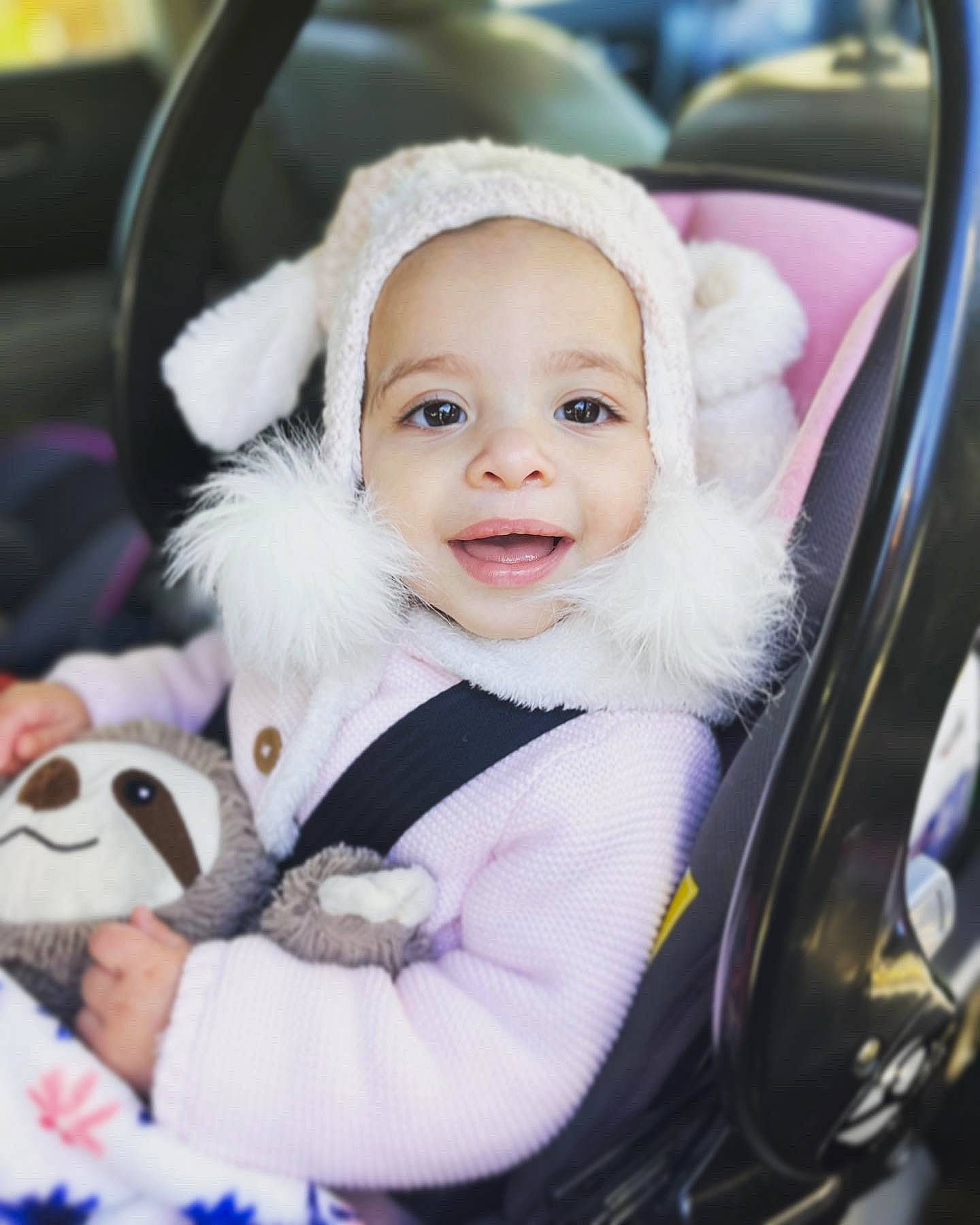 Ava joined the competition — help win amazing prizes! auto_part, baby, baby_carriage, baby_products, baby_safety, baby_toddler_clothing, blue, car_seat, cheek, child, comfort, fashion_accessory, fun, fur, happy, person, skin, smile, toddler, white